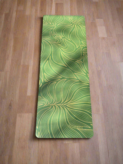 Green patterned mat on a wooden floor