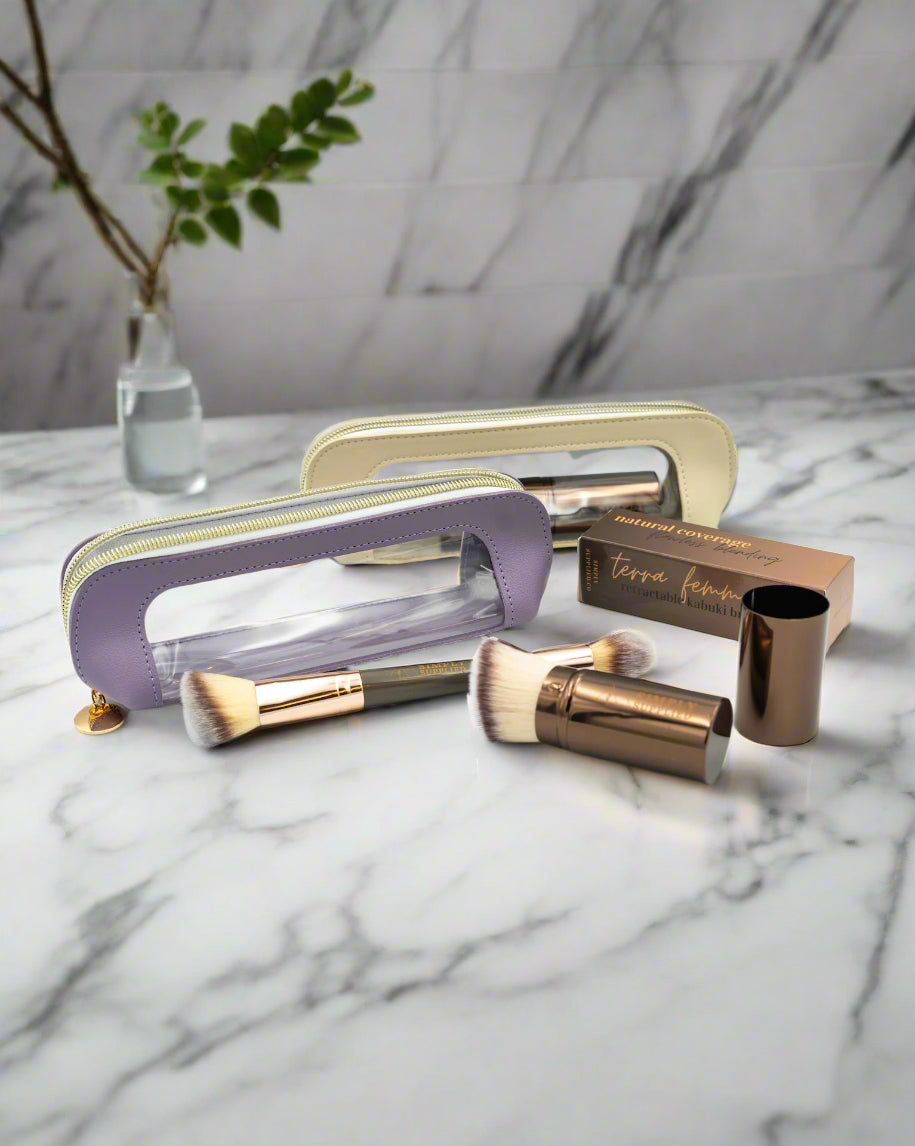 Makeup brushes and accessories on a light gray background